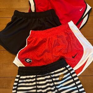 4 pairs of Women's Nike shorts in red and black (3 size XS, 1 size S)